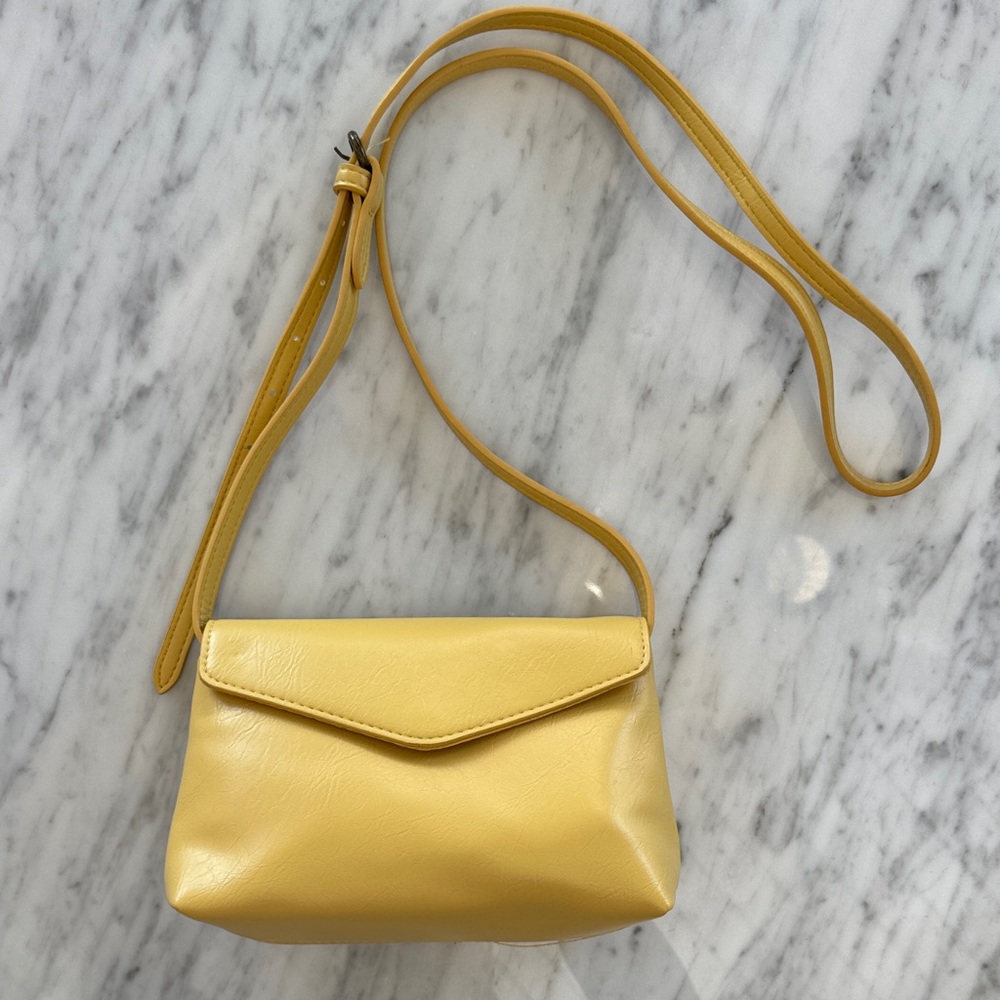 Yellow Crossbody Shoulder Bag with shoulder strap.